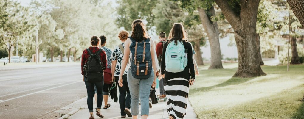 a group of people walking on a road